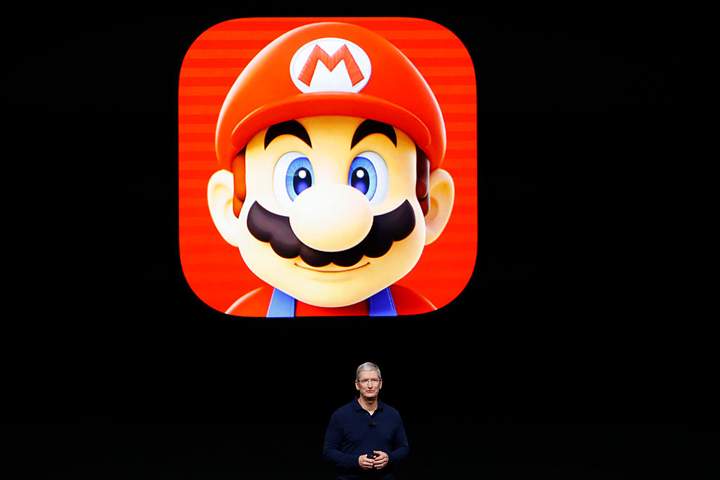 Apple CEO Tim Cook speaks on stage during a launch event on September 7, 2016 in San Francisco, California.