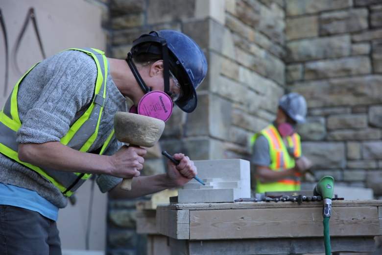 A stonemason concentrates as she works to shape a block of stone that will fit into the West Block’s facade. Masons from all over the world have come to Ottawa to work on the iconic building, and the emphasis has been on preserving as much of the original material and design as possible. About 80 per cent of the stone was re-used.