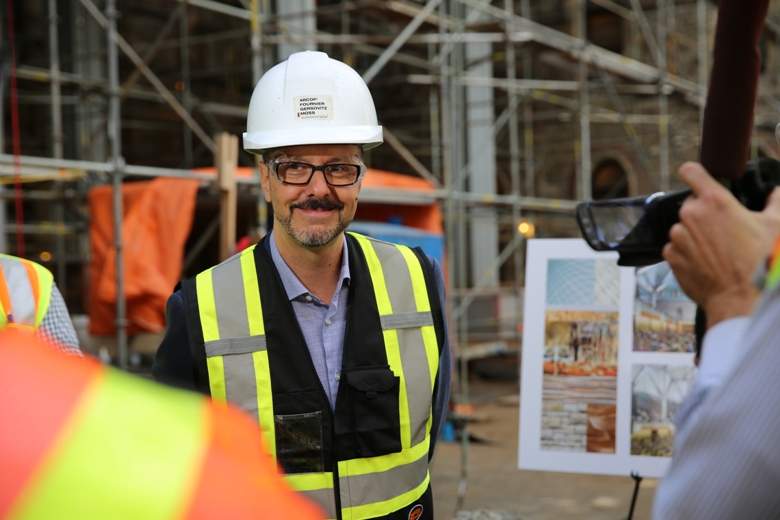 Architect Georges Drolet speaks to reporters about how an old courtyard will become the new House of Commons. The design team has tried to keep the physical layout of the chamber the same so that government business can go on as usual.
