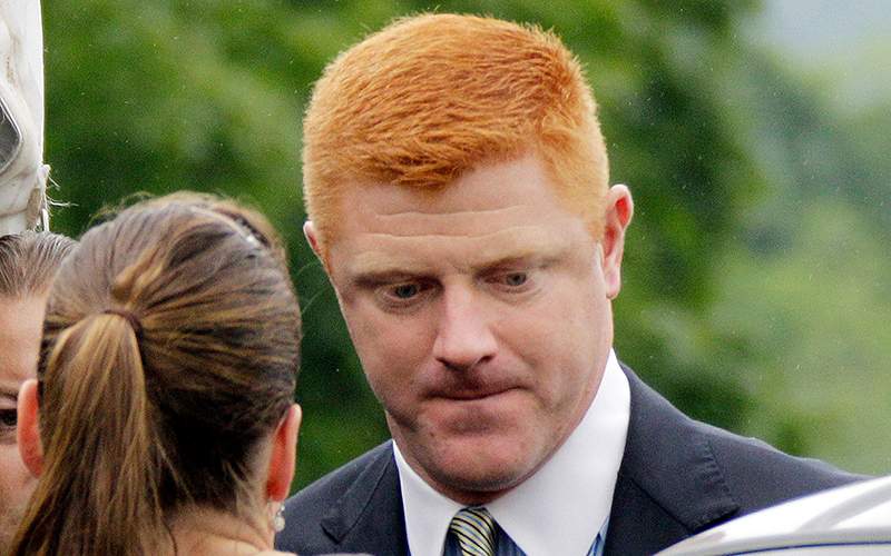 Former Penn State University assistant football coach Mike McQueary arrives at the Centre County Courthouse in Bellefonte, Pa. 