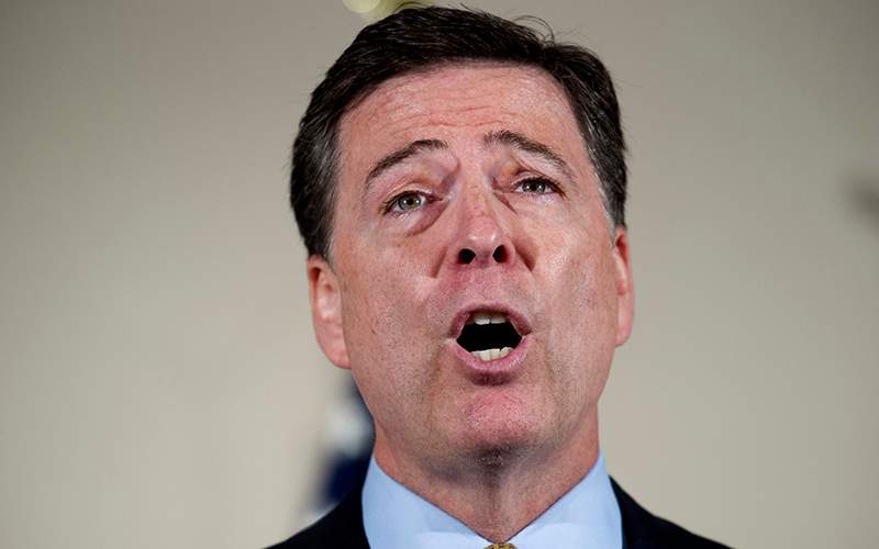 FBI Director James Comey makes a statement at FBI Headquarters in Washington regarding its investigation into Hillary Clinton's use of a private email server while secretary of state. 