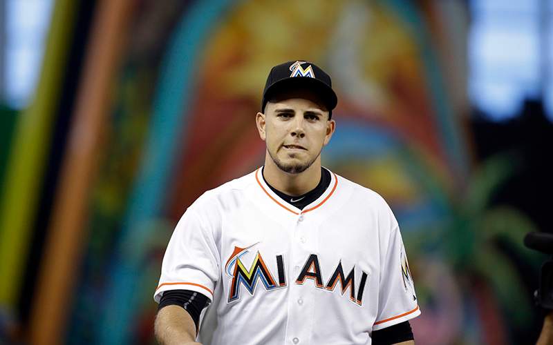 Miami Marlins starting pitcher Jose Fernandez walks to the dugout before a baseball game against the Cincinnati Reds in Miami. 