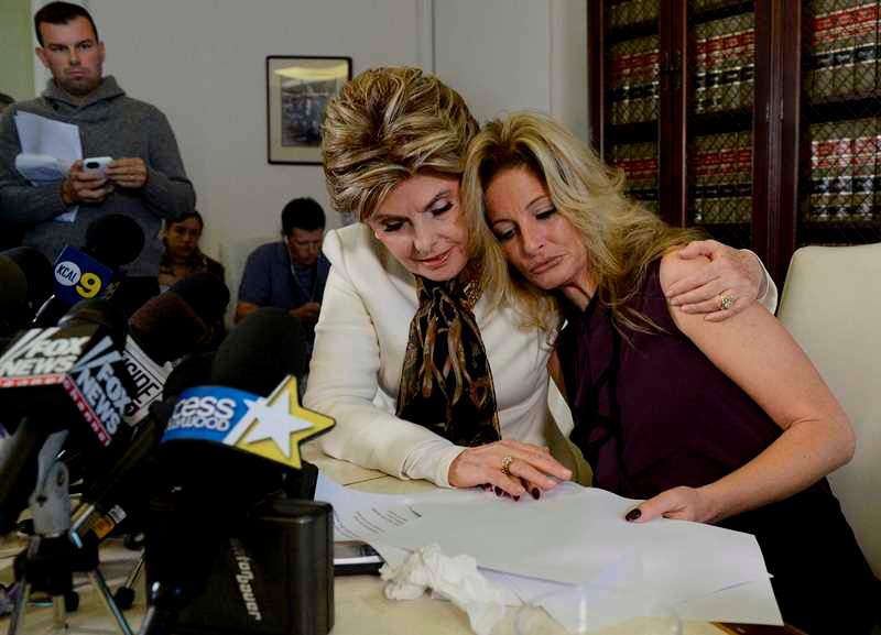 Summer Zervos, a former contestant on the TV show The Apprentice, is embraced by lawyer Gloria Allred (L) while speaking about allegations of sexual misconduct against Donald Trump during a news conference in Los Angeles, California, U.S. October 14, 2016. REUTERS/Kevork Djansezian