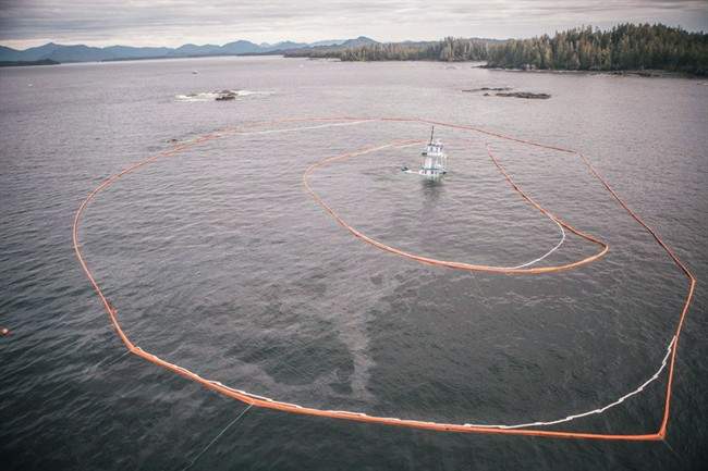 The Nathan E. Stewart is seen surrounded by booms after sinking near Bella Bella. 