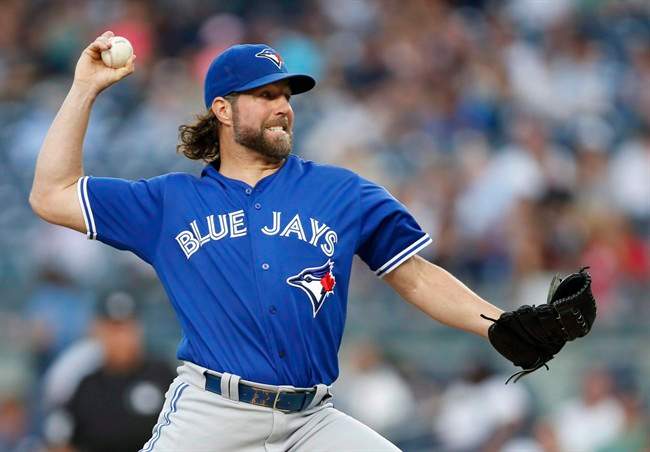 Toronto Blue Jays starting pitcher R.A. Dickey throws during the first inning of a baseball game against the New York Yankees in New York, Monday, Aug. 15, 2016. 