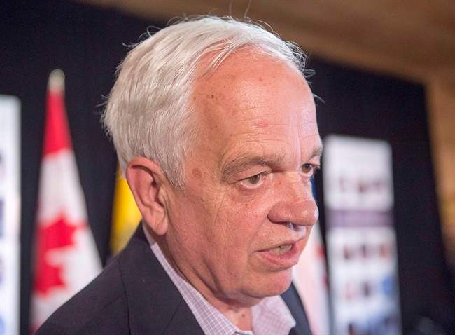 Immigration Minister John McCallum talks with reporters at a meeting of Atlantic Canada's four premiers and federal ministers at the farm of Lawrence MacAulay, MP for Cardigan, in St. Peters Bay, P.E.I. on Monday, July 4, 2016.