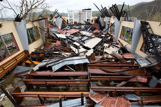 Saint Anne church lays totally destroyed by Hurricane Matthew in Camp Perrin, a district of Les Cayes, Haiti, Thursday, Oct. 6, 2016. Two days after the storm rampaged across the country's remote southwestern peninsula, authorities and aid workers still lack a clear picture of what they fear is the country's biggest disaster in years. (AP Photo/Dieu Nalio Chery)