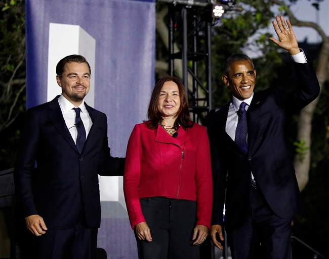 President Barack Obama, right, arrives with actor Leonardo DiCaprio, left, and Dr. Katharine Hayhoe, to talk about climate change as part of the White House South by South Lawn event in Washington, D.C., Oct. 3, 2016. (AP Photo/Carolyn Kaster)