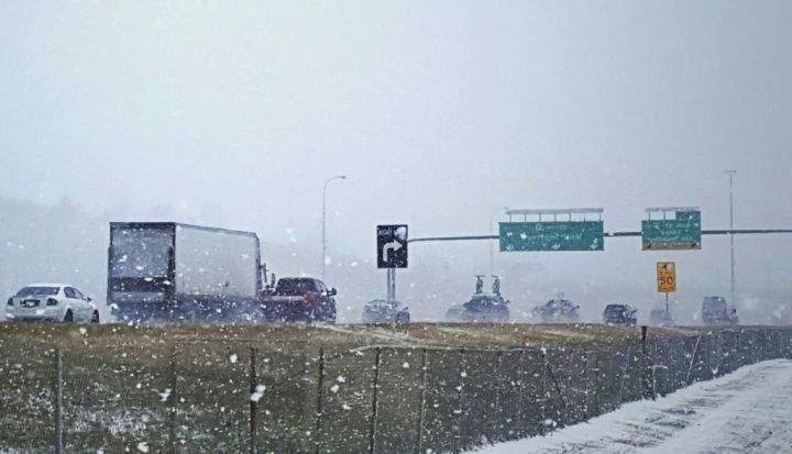 Snow falling on Calgary’s Deerfoot Trail Oct. 7, 2016.