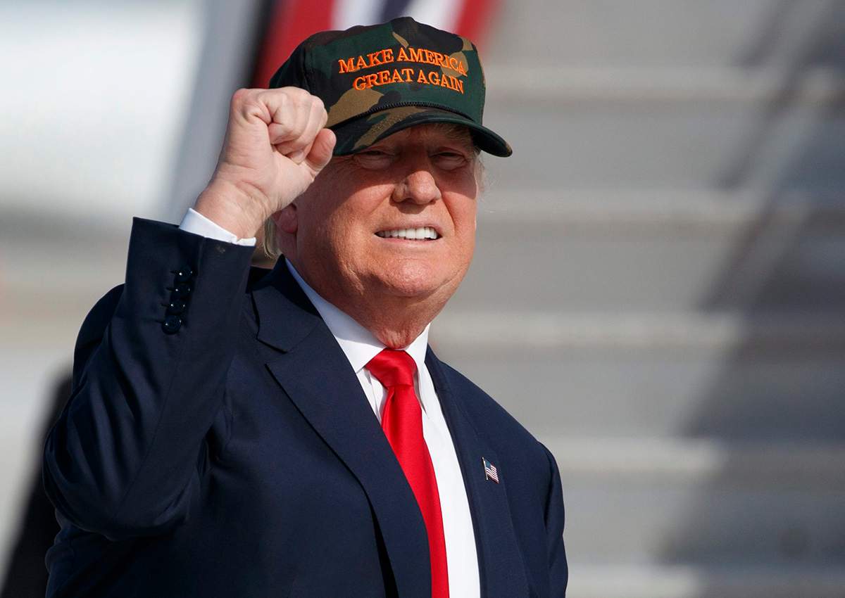 Republican presidential candidate Donald Trump gestures as he arrives to speak to a campaign rally, Tuesday, Oct. 25, 2016, in Sanford, Fla.