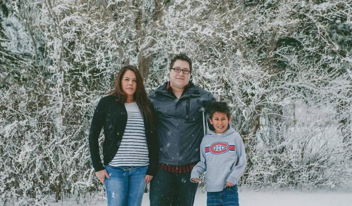 28-year-old Adrienne, the victim of the fatal crash on Oct. 8th poses for a family photo with son and fiance.