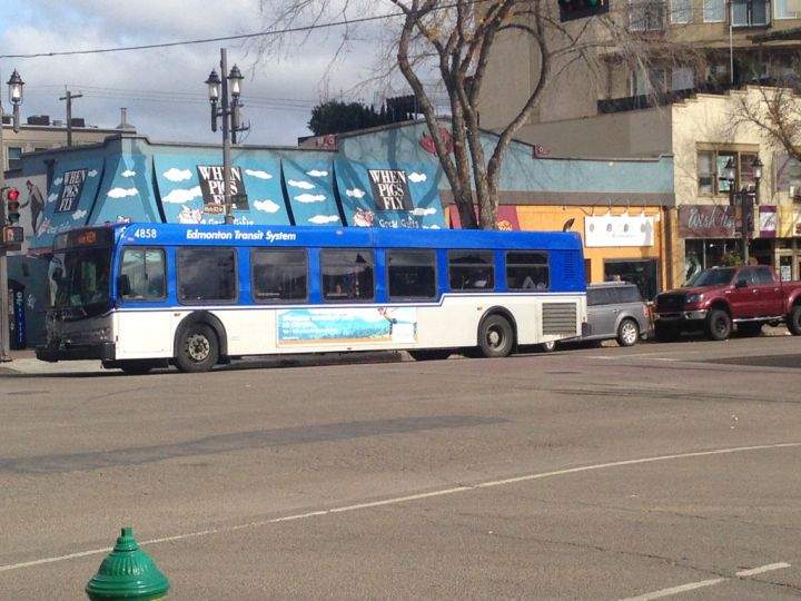 An ETS bus drives down Whyte Avenue in Edmonton on Wednesday, Oct., 5, 2016.