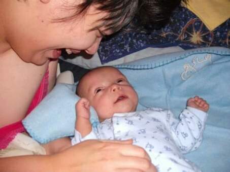 Newborn photo album of Eileen and son Jacob in 2008.