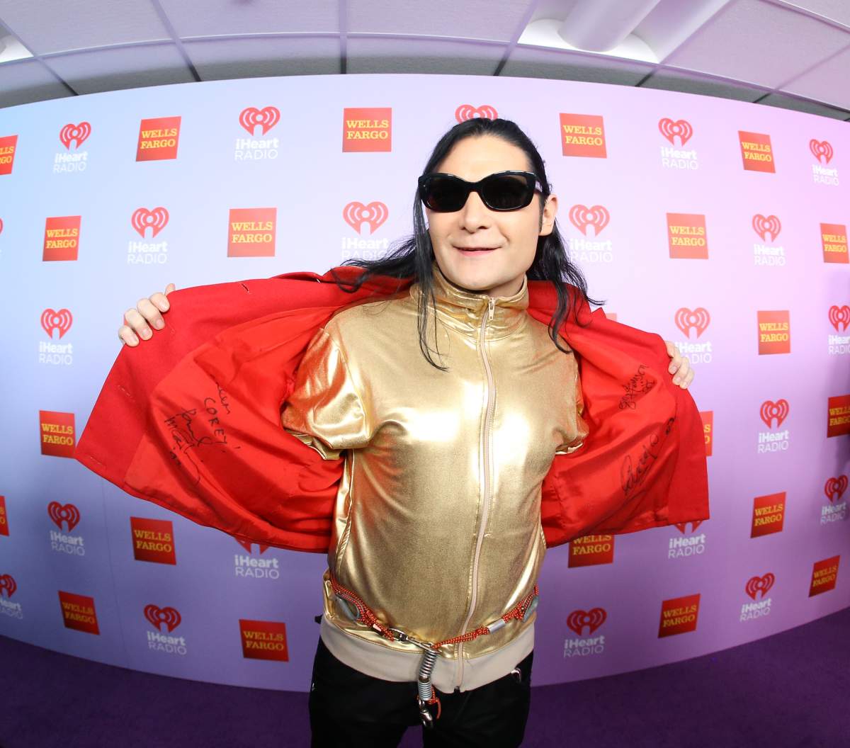 Corey Feldman shows off his autographed jacket of Paul McCartney, Ringo Starr and  George Harrison arrives at the iHeart80s Party 2016 on February 20, 2016 in Inglewood, California.