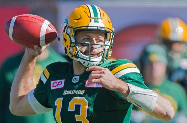 Edmonton Eskimos' quarterback Mike Reilly throws a pass during first half CFL football action against the Montreal Alouettes in Montreal, Monday, October 10, 2016. Reilly and running back John White and B.C. receiver Bryan Burnham are the CFL top performers for Week 16. 