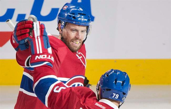 Montreal Canadiens’ Shea Weber (6) celebrates with teammate Andrei Markov (79) after scoring against the Arizona Coyotes during second period NHL hockey action in Montreal, Thursday, October 20, 2016.