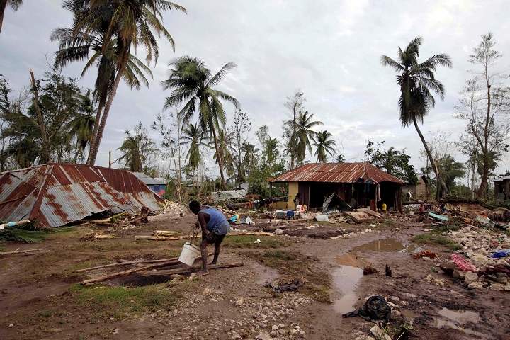 A man gets water from a well in an area destroyed by Hurricane Matthew in Cavaillon, Haiti, October 6, 2016. REUTERS/Andres Martinez Casares.