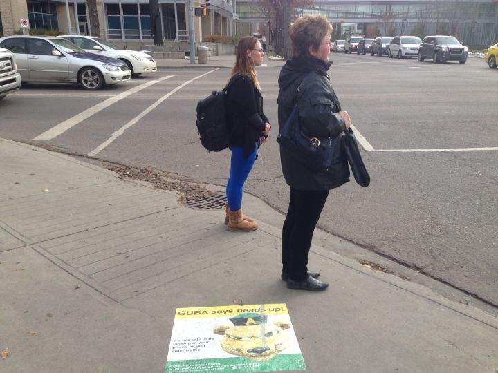 The University of Alberta is testing a $2,500 pilot program aimed at improving pedestrian safety through decals promoting road awareness.