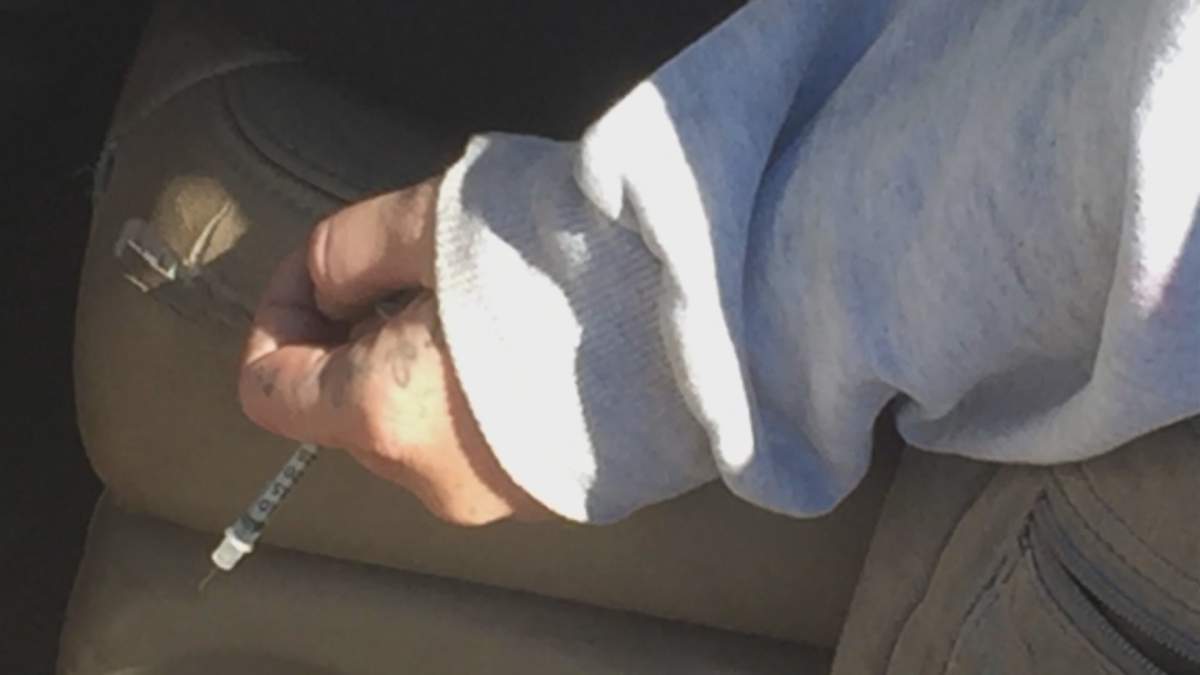 Police release photo of Indiana mother overdosing on heroin with baby in car - image