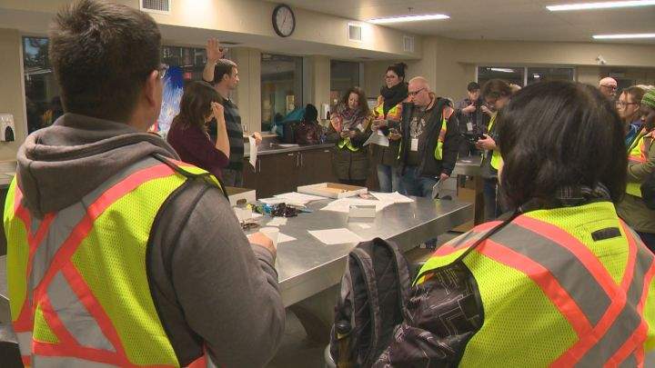 Volunteers get briefed before they begin a count of Edmonton's homeless population on Oct. 19, 2016.