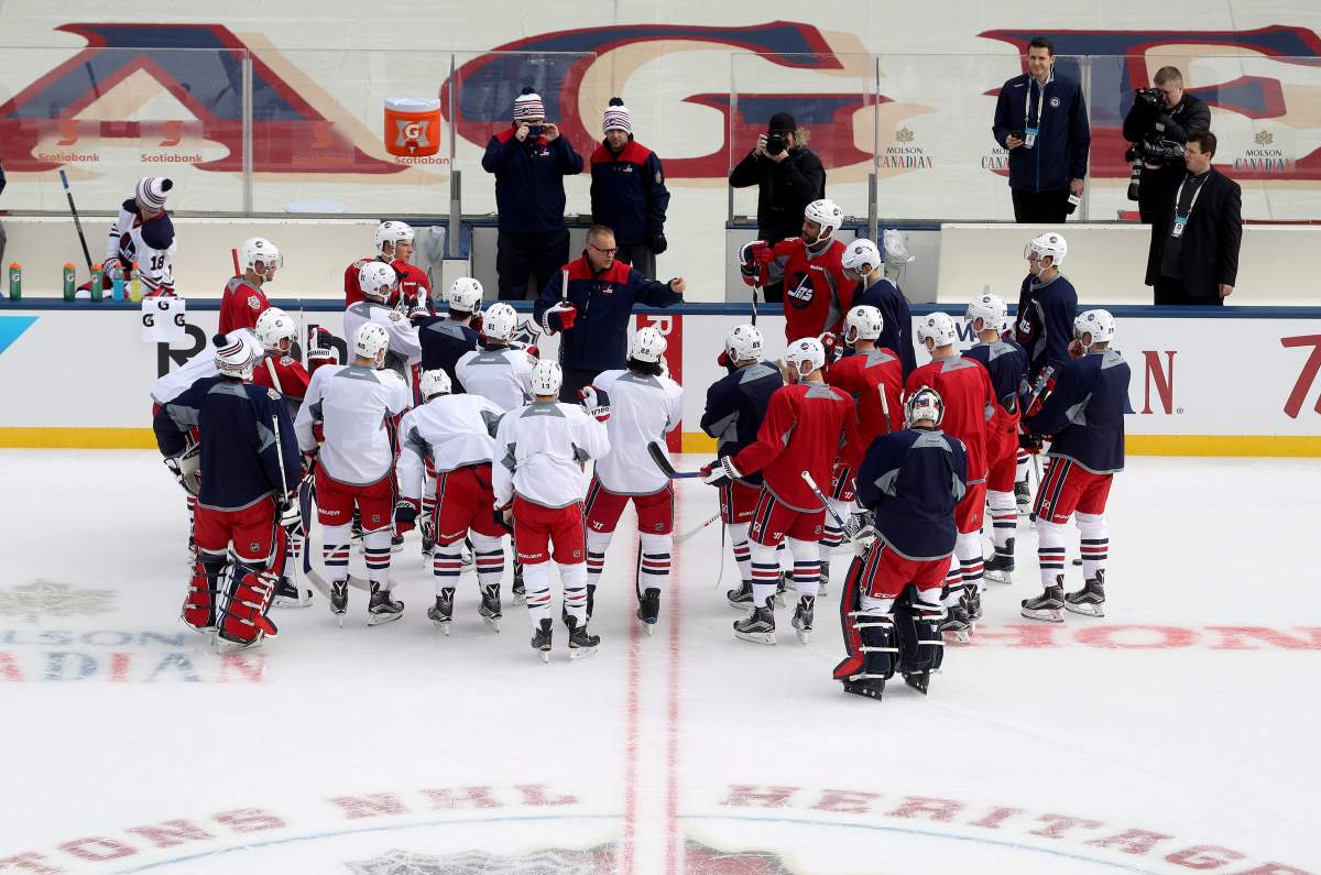 Winnipeg Jets head coach Paul Maurice talks to his players during the teams practice at Investors Group Field in Winnipeg, Saturday, October 22, 2016. The Jets will play the Edmonton Oilers at the NHL Heritage Classic Sunday.