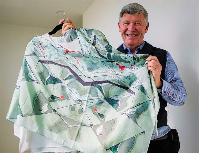 Former oil and gas executive turned fashion designer, Jean-Michel Gires, displays his colourful scarves at a studio in Calgary, Alta., Thursday, Oct. 6, 2016.