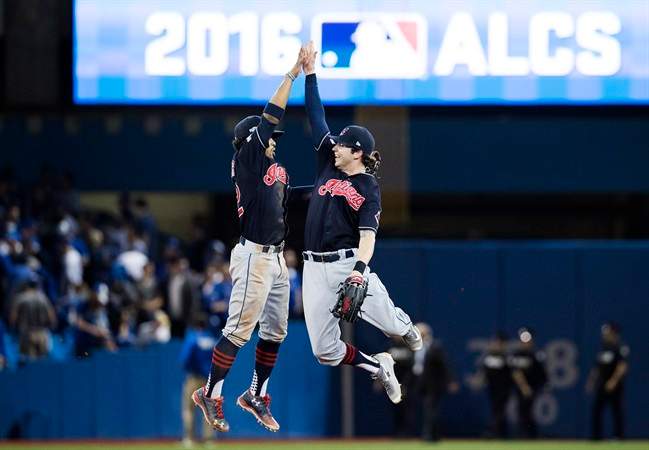 Cleveland Indians shortstop Francisco Lindor, left, and centre fielder Tyler Naquin celebrate after defeating the Toronto Blue Jays in game three of the American League Championship Series baseball action in Toronto on Monday, October 17, 2016.