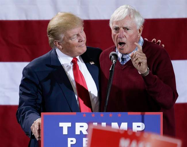 Republican presidential candidate Donald Trump is endorsed by former coach Bobby Knight, during a campaign rally in Grand Rapids, Mich., Monday, Oct. 31, 2016.