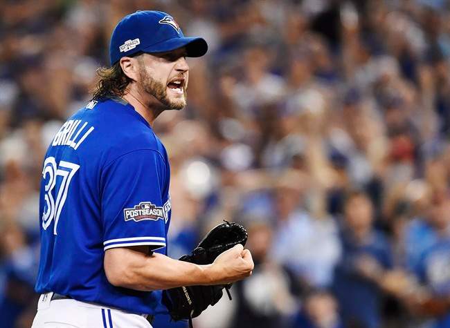 Toronto Blue Jays relief pitcher Jason Grilli (37) reacts on his way to the dugout against the Cleveland Indians during eighth inning, game four American League Championship Series baseball action in Toronto on Tuesday, October 18, 2016.