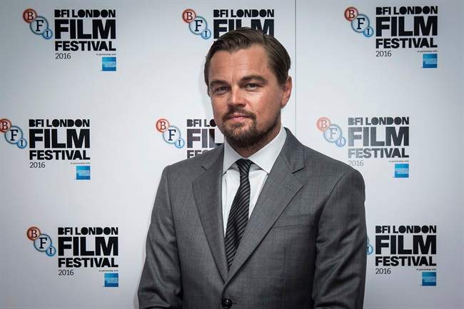 In a Saturday, Oct. 15, 2016 file photo, a ctor Leonardo DiCaprio poses for photographers during a photo call to promote the film 'Before the Flood' which is showing as part of the London Film Festival in London.