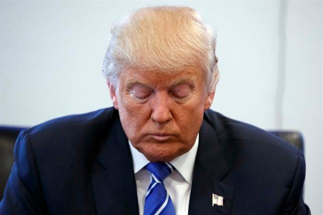 Republican presidential candidate Donald Trump pauses during a meeting with members of the National Border Patrol Council at Trump Tower, Friday, Oct. 7, 2016, in New York.
