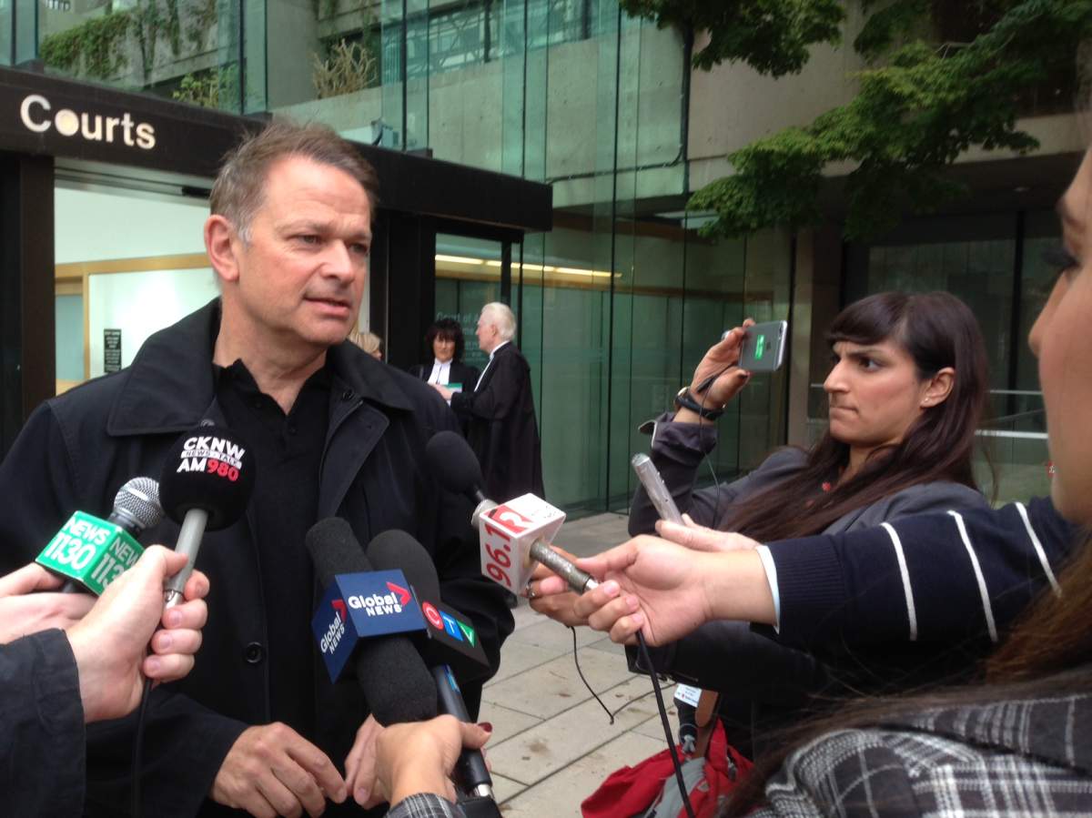 Battersby’s former boss Paul Dragan speaks with reporters outside the BC Courts on Oct.21, 2016.