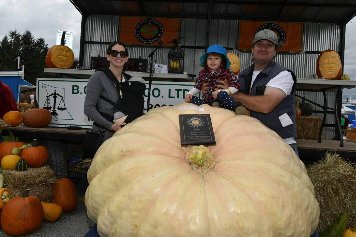 Scott Carley and his family show up his prize-winning pumpkin.