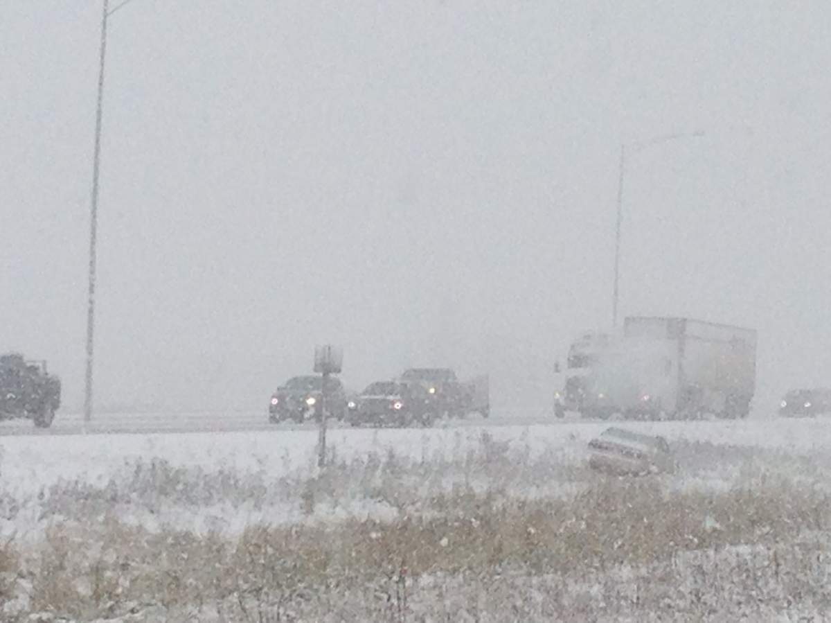 Leduc RCMP warn motorists to drive with care on the QE2 during a snowfall, Friday, Oct. 14, 2016.  
