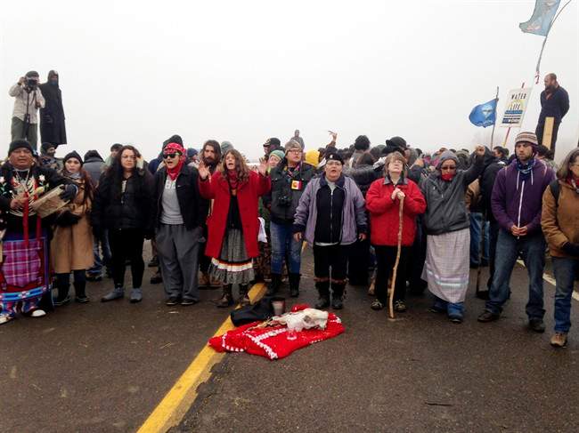 Protesters against the construction of the Dakota Access oil pipeline block a highway in near Cannon Ball, N.D., on Wednesday, Oct. 26, 2016.