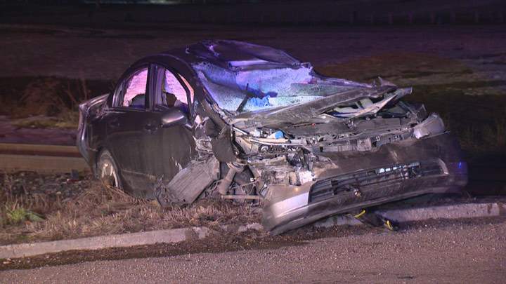 Police are trying to determine why a man drove his car into a moving freight train at a Saskatoon rail crossing.