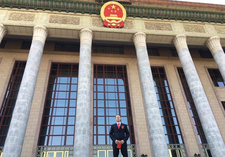 This photo was taken at a press conference for the team in front of The Great Hall of the People - an exclusive building in Beijing only used for ceremonial or legislative activities of the government.