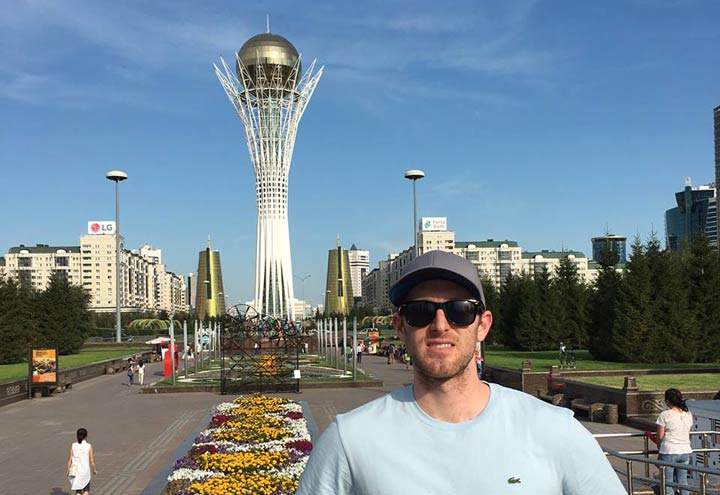 This photo of Collins was taken in Astana, Kazakhstan, in front of the Bayterek monument.