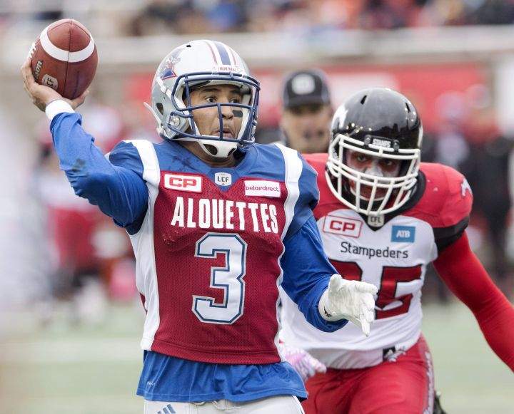 Montreal Alouettes quarterback Vernon Adams Jr. gets set to pass as he is chased by Calgary Stampeders lineman Micah Johnson during second quarter CFL football action Sunday, October 30, 2016 in Montreal.