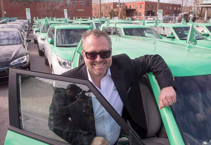In this file photo, Alexandre Taillefer poses for photos with his new fleet of electric taxis at the launch Wednesday, November 18, 2015 in Montreal. 