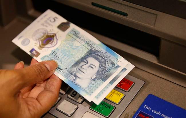 The British pound surged Thursday. (AP Photo/Alastair Grant, File).