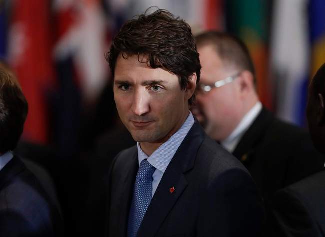 FILE - In this Tuesday, Sept. 20, 2016 file photo, Canadian Prime Minister Justin Trudeau as he mingles before the start of the 71st session of the United Nations General Assembly at the UN headquarters in New York.