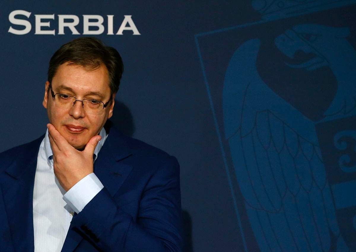 Serbian Prime Minister Aleksandar Vucic gestures, during a press conference, in Belgrade, Serbia, Sunday, Oct. 30, 2016. Vucic was moved to a safe location after a large cache of weapons was found Saturday near his family house outside Belgrade, the interior minister said. (AP Photo/Darko Vojinovic).