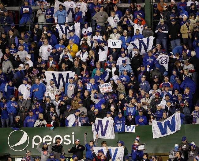 Fans celebrate after Game 5 of the Major League Baseball World Series between the Cleveland Indians and the Chicago Cubs Sunday, Oct. 30, 2016, in Chicago. 