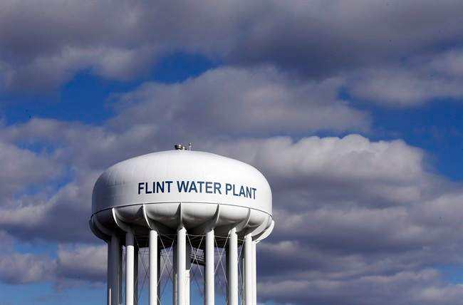 In this March 21, 2016 file photo, the Flint Water Plant water tower is seen. (AP Photo/Carlos Osorio, File).