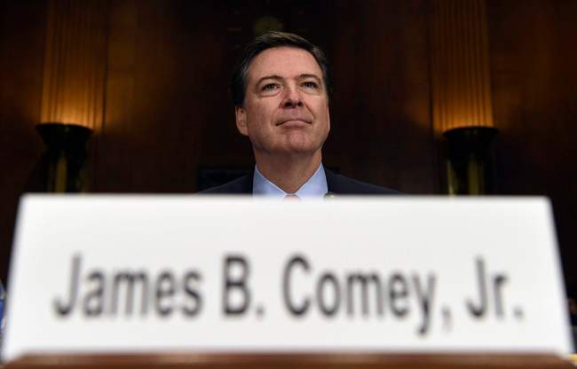FBI Director James Comey prepares to testify on Capitol Hill in Washington in this Dec. 9, 2015 file photo.