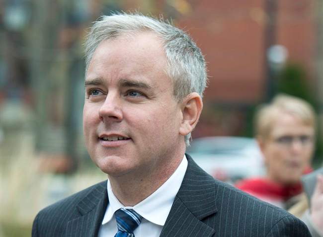 Dennis Oland heads from a bail hearing after being released from custody in Fredericton on Tuesday, Oct. 25, 2016. 