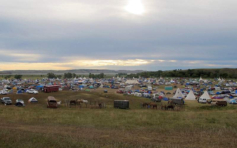 More than a thousand people gather at an encampment near North Dakota's Standing Rock Sioux reservation. 
