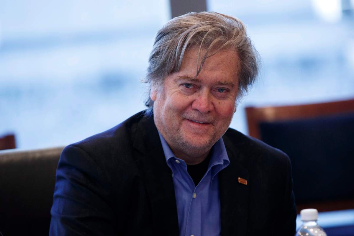 Steve Bannon, campaign CEO for Republican presidential candidate Donald Trump, right, looks on during a national security meeting with advisors at Trump Tower, Friday, Oct. 7, 2016, in New York. 
