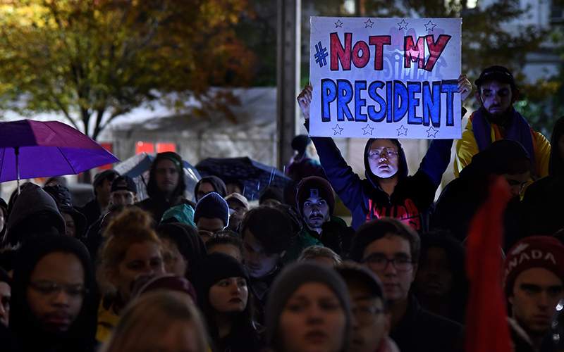 Maddy Ballard, of Philadelphia, participates in a protest at City Hall's Thomas Paine Plaza, Wednesday, Nov. 9, 2016,  in opposition of Donald Trump's presidential election victory. 